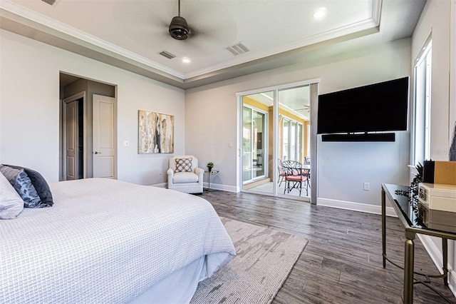 16 Franklin Ct S Unit A, Saint Petersburg, FL 33711 - bedroom with a tray ceiling, dark wood finished floors, visible vents, baseboards, and access to outside