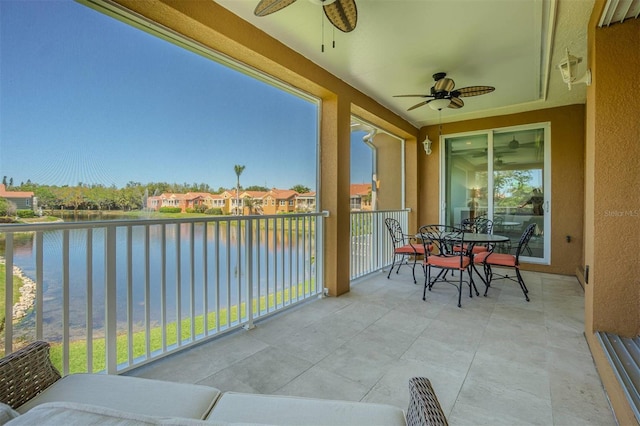 16 Franklin Ct S Unit A, Saint Petersburg, FL 33711 - balcony with a water view, outdoor dining area, and a ceiling fan