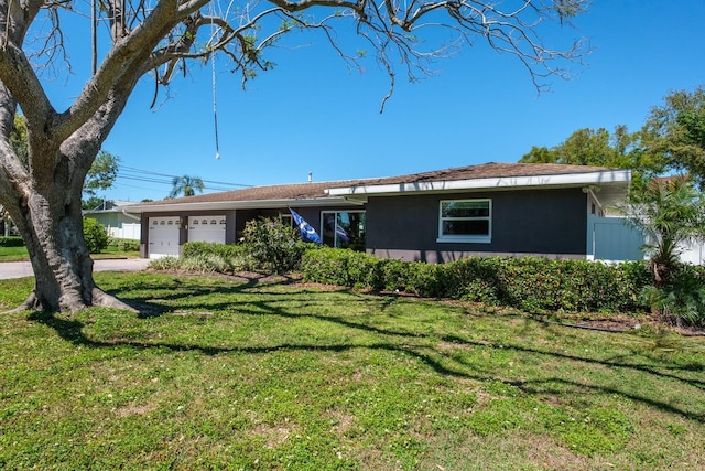 1828 Stancel Dr, Clearwater, FL 33764 - ranch-style home featuring a front yard, a garage, and driveway