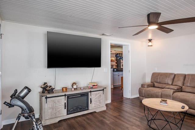 1828 Stancel Dr, Clearwater, FL 33764 - living area featuring visible vents, baseboards, ceiling fan, and dark wood-style flooring