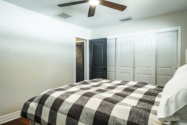 1828 Stancel Dr, Clearwater, FL 33764 - bedroom with a closet, visible vents, a ceiling fan, and wood finished floors
