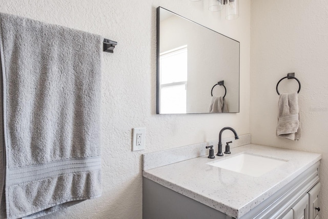 1828 Stancel Dr, Clearwater, FL 33764 - bathroom with vanity and a textured wall