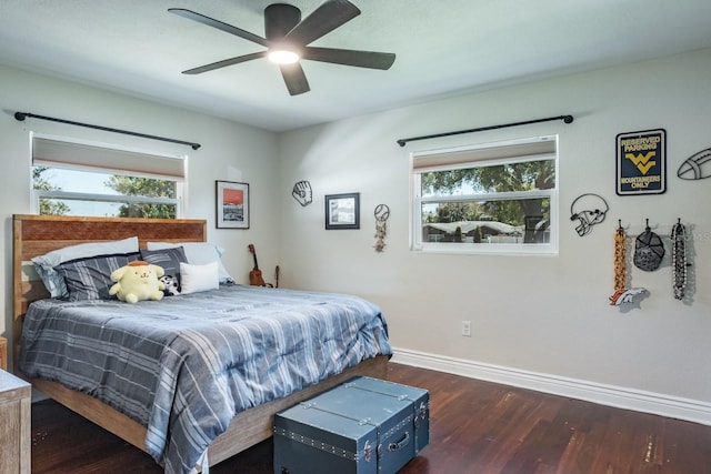 1828 Stancel Dr, Clearwater, FL 33764 - bedroom with baseboards, multiple windows, wood finished floors, and a ceiling fan