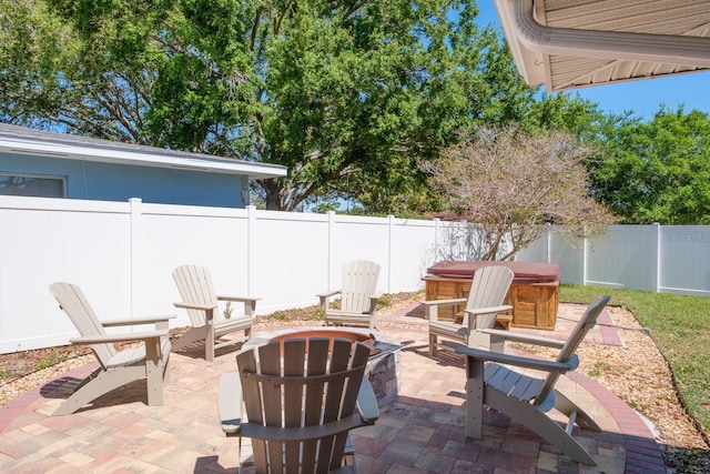 1828 Stancel Dr, Clearwater, FL 33764 - view of patio with a hot tub and a fenced backyard