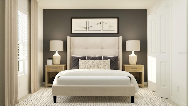 bedroom featuring baseboards and light colored carpet
