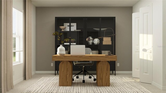 office featuring light colored carpet and baseboards