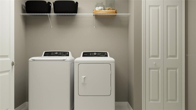 laundry area with independent washer and dryer