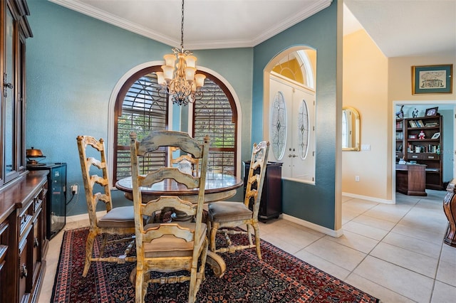 dining area with arched walkways, crown molding, a chandelier, and light tile patterned floors