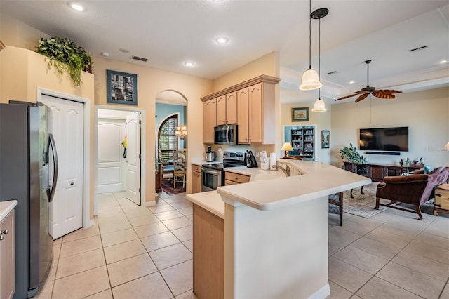 kitchen with light tile patterned flooring, a peninsula, ceiling fan, stainless steel appliances, and open floor plan