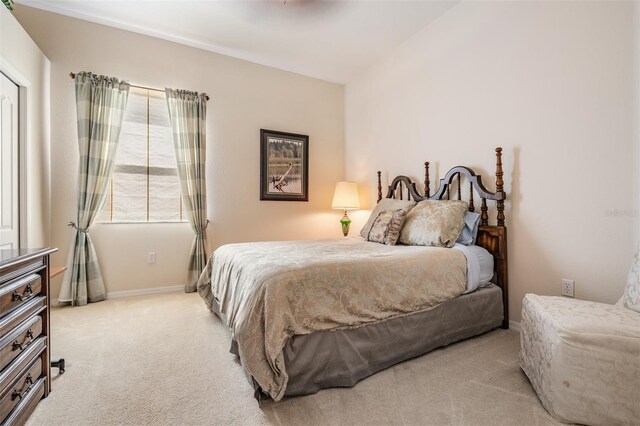bedroom with baseboards and carpet floors