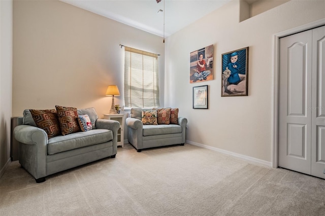 living room with baseboards and carpet floors