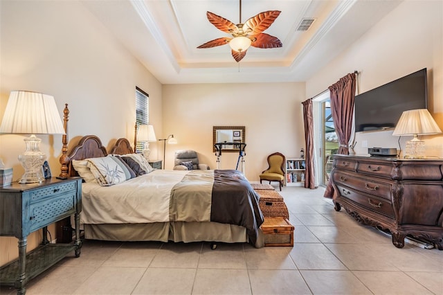 bedroom featuring crown molding, a raised ceiling, tile patterned floors, ceiling fan, and visible vents
