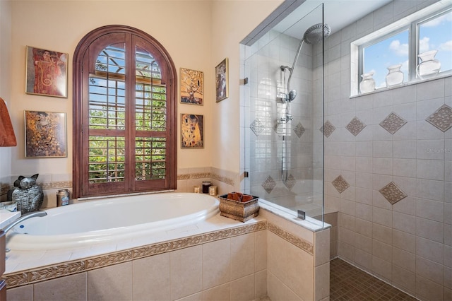 full bathroom with a garden tub and walk in shower