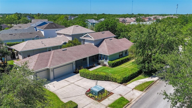 birds eye view of property with a residential view