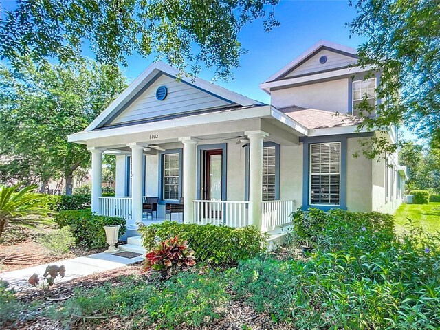 view of front of home with stucco siding and a porch