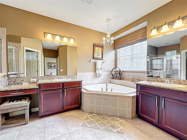 full bath with two vanities, a garden tub, a sink, and a shower stall