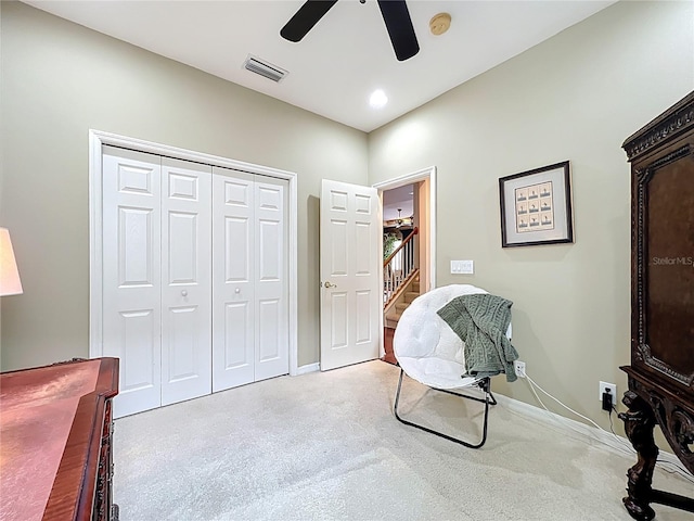 sitting room with ceiling fan, baseboards, carpet floors, and visible vents