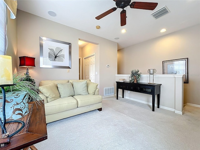 carpeted living room with baseboards, a ceiling fan, visible vents, and recessed lighting