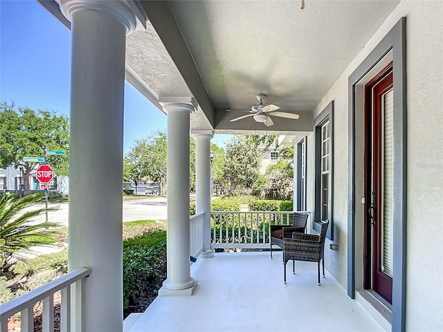 balcony featuring a porch and ceiling fan