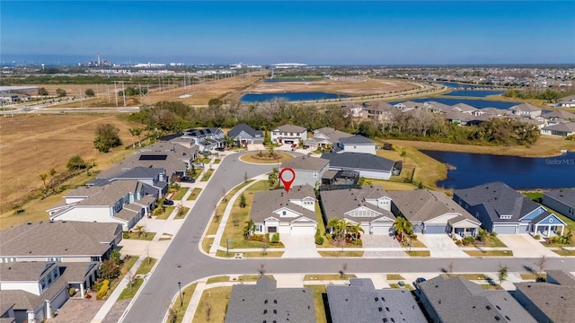 bird's eye view with a residential view and a water view