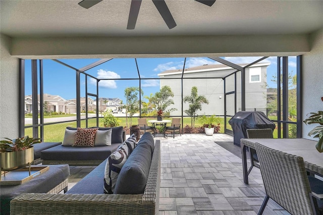 view of patio featuring a residential view, an outdoor living space, grilling area, a lanai, and ceiling fan