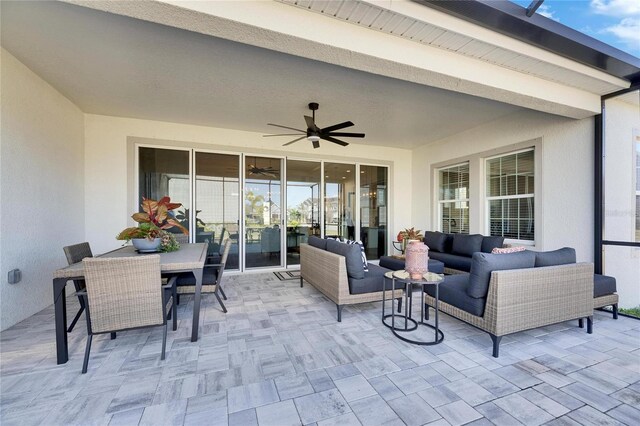 view of patio with outdoor dining area, outdoor lounge area, and ceiling fan
