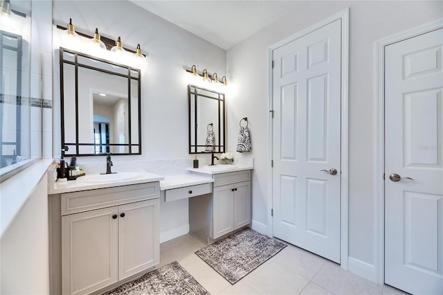 full bath with tile patterned floors and vanity