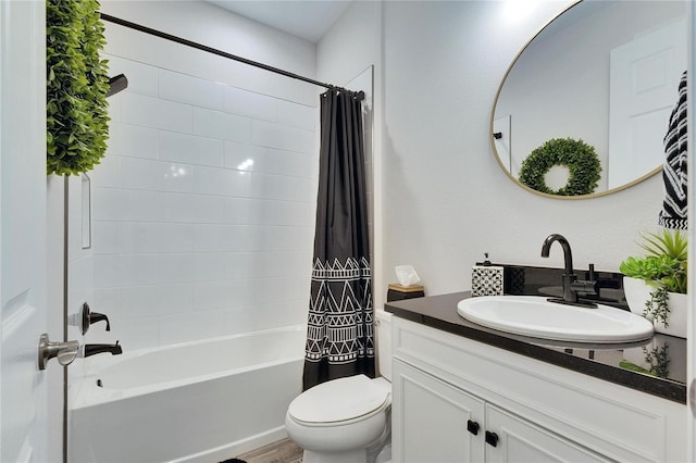 bathroom featuring shower / bath combo, vanity, and toilet