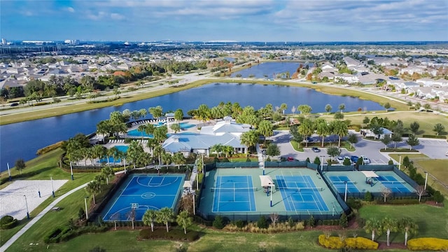 birds eye view of property with a water view and a residential view