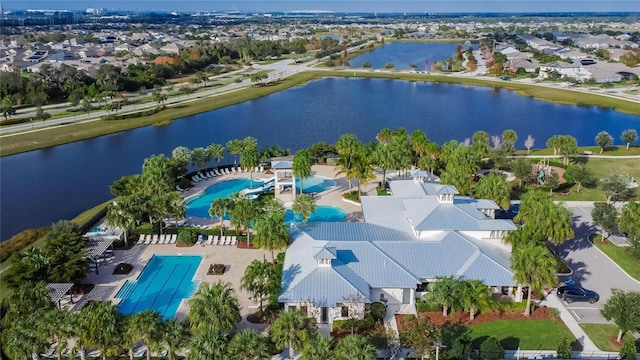 bird's eye view featuring a water view and a residential view