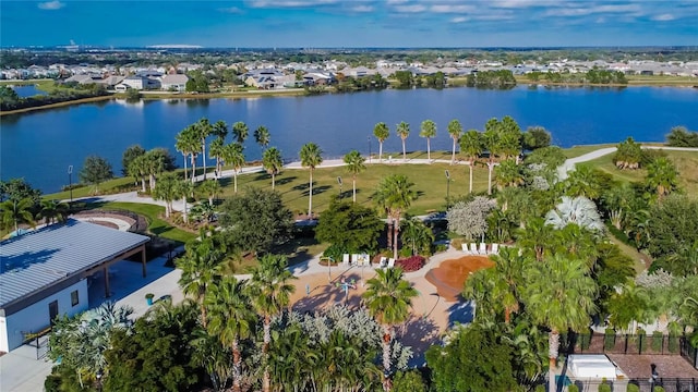 drone / aerial view with a residential view and a water view