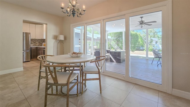 dining space with a wealth of natural light, baseboards, and light tile patterned flooring