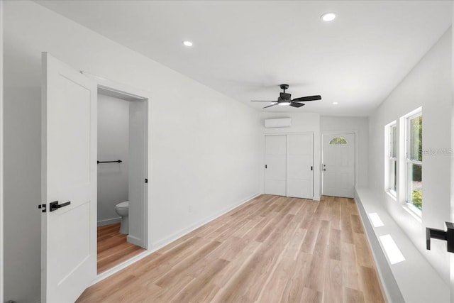 6531 2nd Ave N, Saint Petersburg, FL 33710 - unfurnished bedroom featuring recessed lighting, light wood-style flooring, a closet, and a wall unit AC