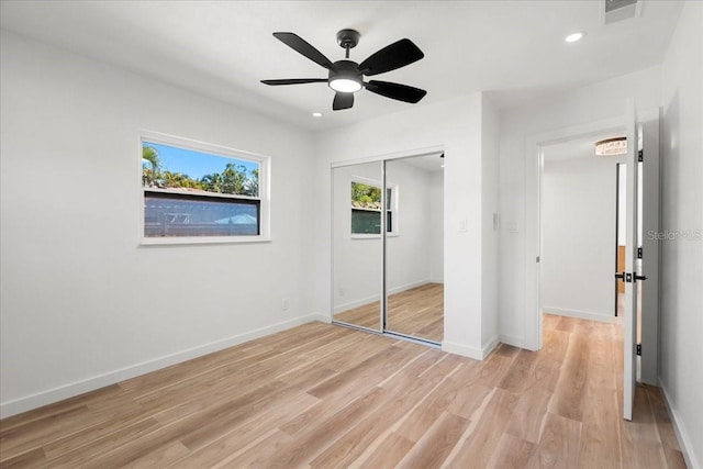 6531 2nd Ave N, Saint Petersburg, FL 33710 - unfurnished bedroom with light wood-style flooring, a closet, visible vents, recessed lighting, and baseboards
