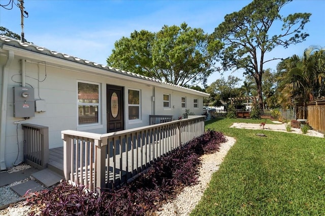 6531 2nd Ave N, Saint Petersburg, FL 33710 - view of yard featuring a wooden deck and fence