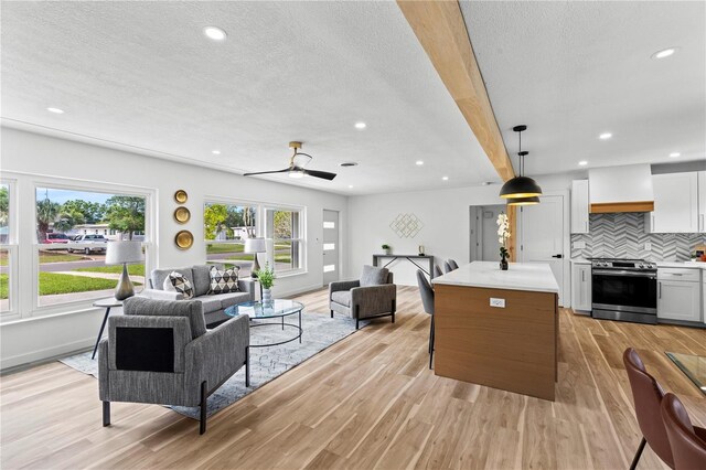 6531 2nd Ave N, Saint Petersburg, FL 33710 - living area with light wood finished floors, recessed lighting, and a textured ceiling