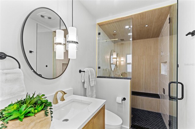 6531 2nd Ave N, Saint Petersburg, FL 33710 - full bath with toilet, a stall shower, vanity, and recessed lighting
