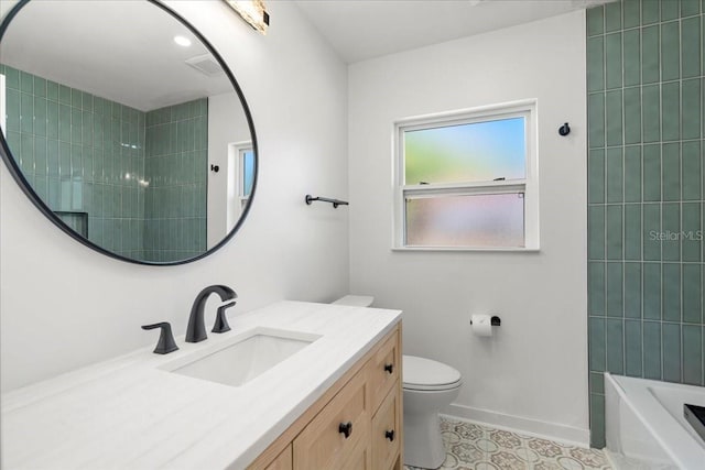 6531 2nd Ave N, Saint Petersburg, FL 33710 - bathroom with toilet, vanity, tile patterned floors, and baseboards