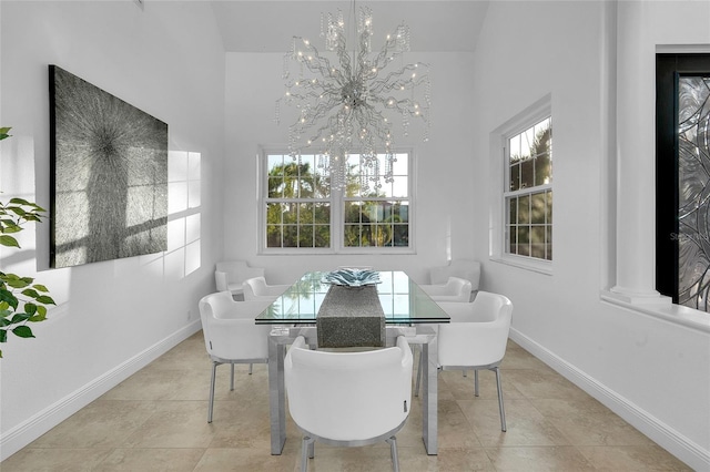 6113 Pasadena Point Blvd, Gulfport, FL 33707 - tiled dining room with a chandelier and a towering ceiling
