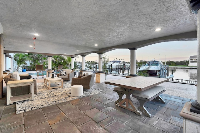 6113 Pasadena Point Blvd, Gulfport, FL 33707 - view of patio / terrace with a water view, a boat dock, and boat lift