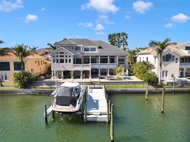6113 Pasadena Point Blvd, Gulfport, FL 33707 - dock with boat lift, a water view, a balcony, and a patio