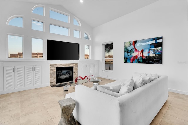 6113 Pasadena Point Blvd, Gulfport, FL 33707 - tiled living room with high vaulted ceiling and a stone fireplace