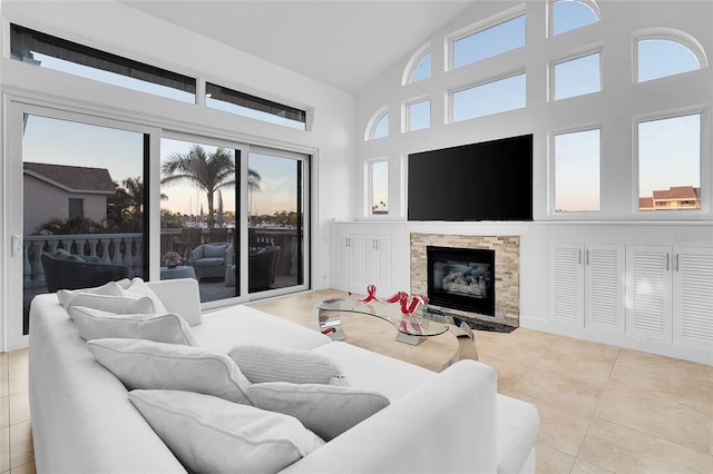 6113 Pasadena Point Blvd, Gulfport, FL 33707 - tiled living area with high vaulted ceiling and a stone fireplace