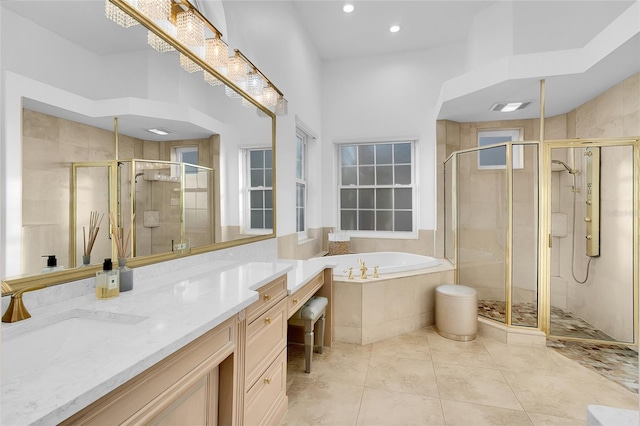 6113 Pasadena Point Blvd, Gulfport, FL 33707 - full bathroom featuring vanity, a bath, a stall shower, and recessed lighting