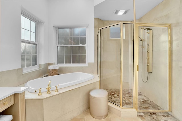 6113 Pasadena Point Blvd, Gulfport, FL 33707 - bathroom with a garden tub, a stall shower, and vanity
