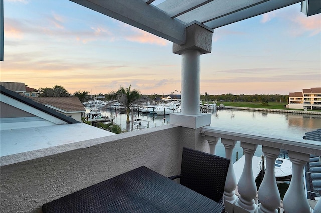 6113 Pasadena Point Blvd, Gulfport, FL 33707 - balcony at dusk featuring a water view