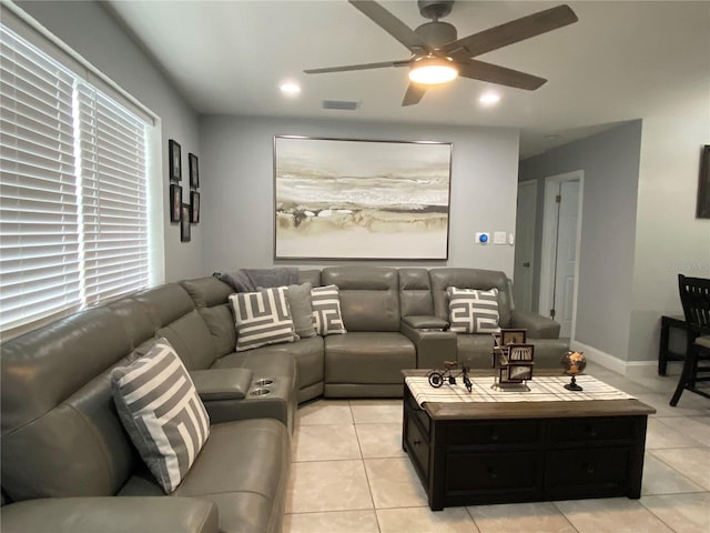 living area featuring light tile patterned floors, a ceiling fan, visible vents, baseboards, and recessed lighting