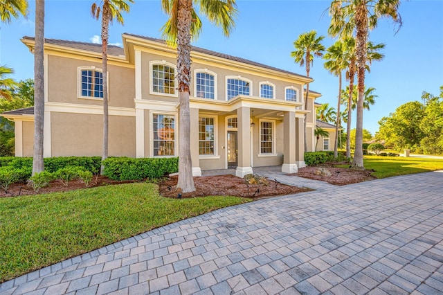 19005 Cour Ests, Lutz, FL 33558 - view of front facade with a front yard and stucco siding