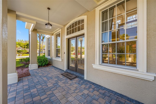 19005 Cour Ests, Lutz, FL 33558 - property entrance with french doors and stucco siding