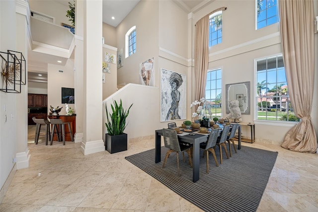 19005 Cour Ests, Lutz, FL 33558 - dining space with a high ceiling, stairs, baseboards, and recessed lighting